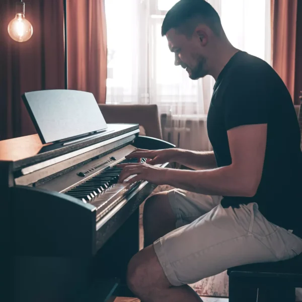 male-musician-plays-the-electronic-piano-in-the-ro-2025-04-01-08-10-00-utc